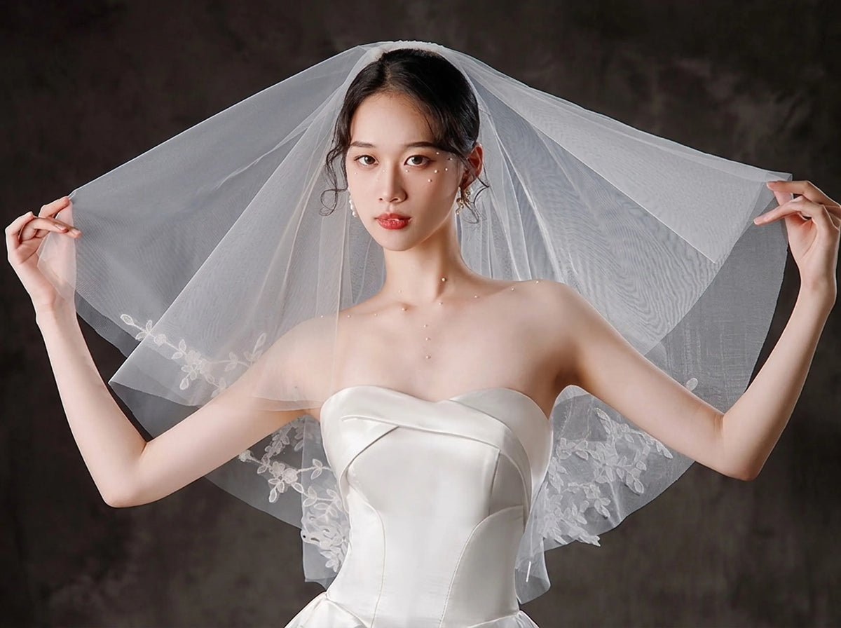 bride wearing a short two tier floral wedding veil