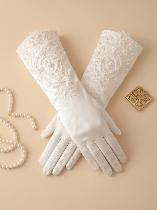 Regal 35cm white satin bridal gloves featuring heavy hand-beaded lace appliques with shimmering beads, micro-crystals, and light-reflecting sequins.