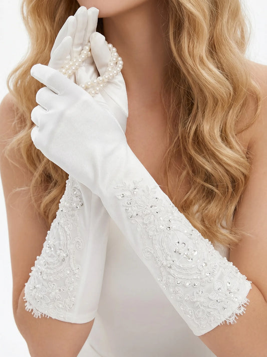 Regal 35cm white satin bridal gloves featuring heavy hand-beaded lace appliques with shimmering beads, micro-crystals, and light-reflecting sequins.