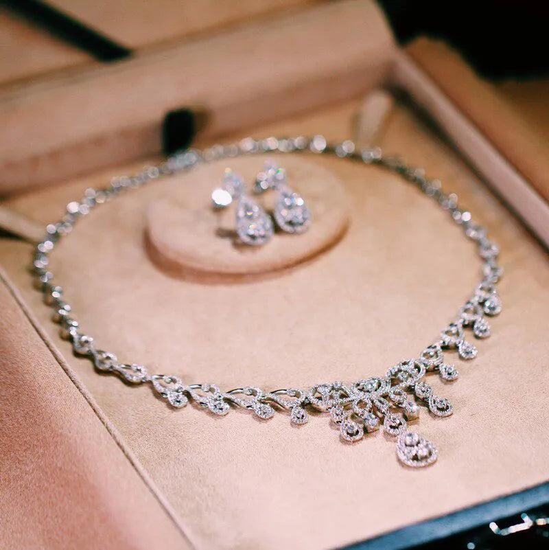 Hollow teardrop zircon bridal jewelry set with vintage lace carved necklace and double-layer drop earrings, elegant wedding accessories