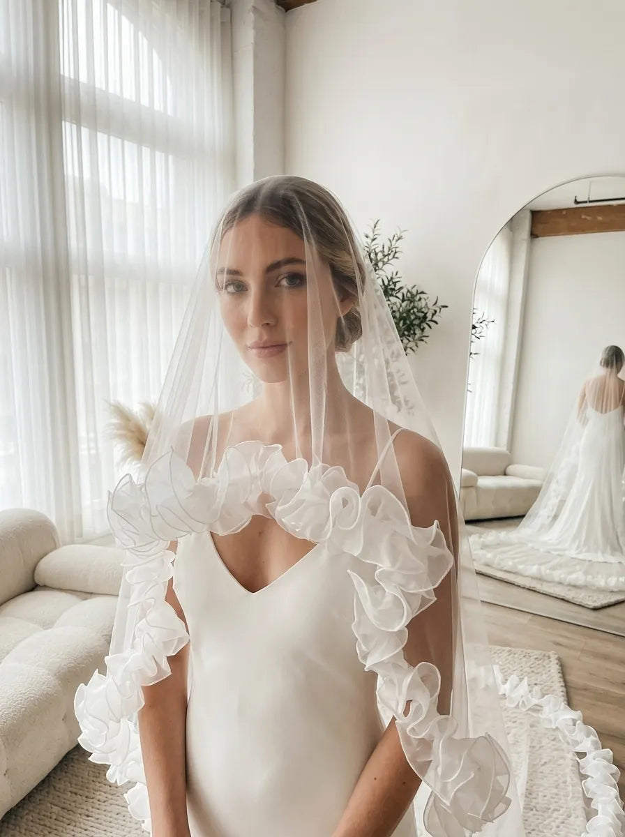 dramatic ruffle edge cathedral wedding veil with soft tulle trim