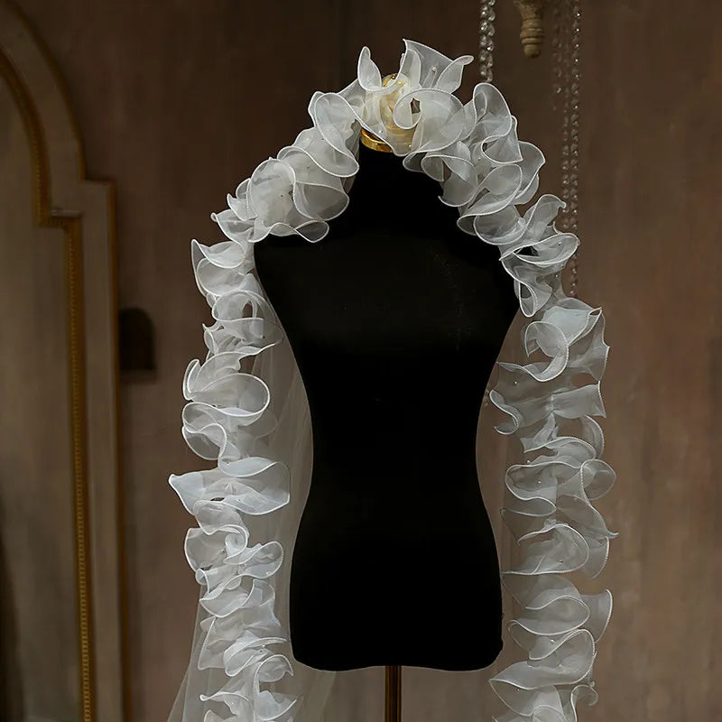 close up of voluminous ruffle edge wedding veil detail